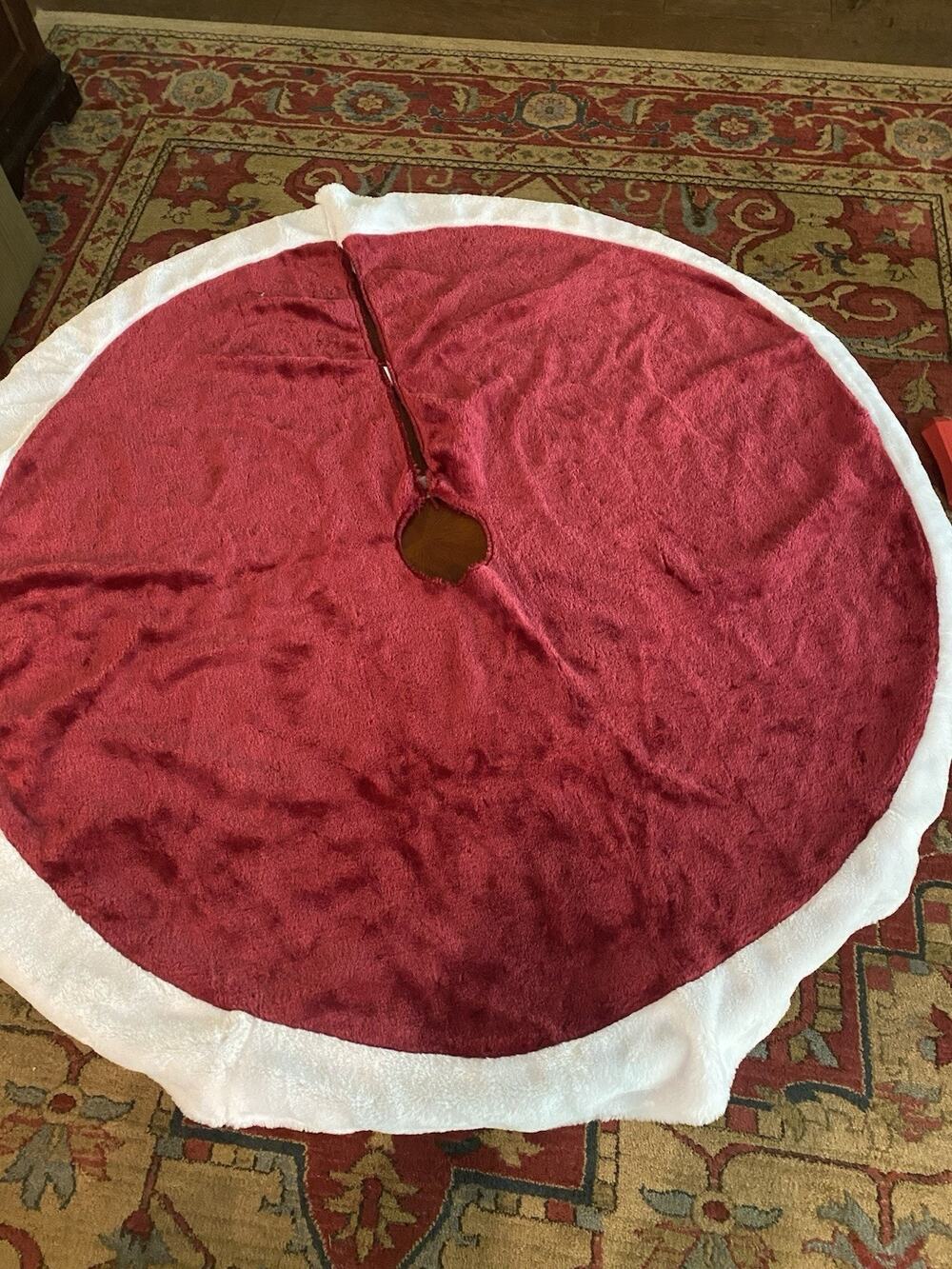 Red velvet tree skirt features a luxurious white border. A Classic ! 47”